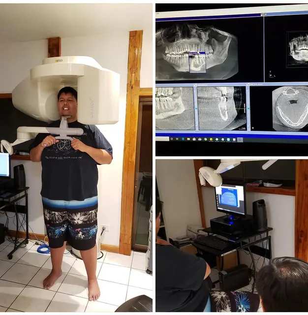 Patient standing in a 3D dental scanner beside screens showing jaw scans